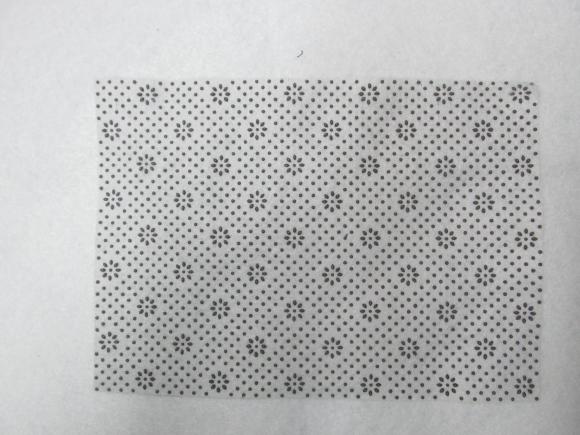 白色太阳花点塑无纺布